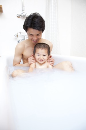 Father and son in the bathの写真素材