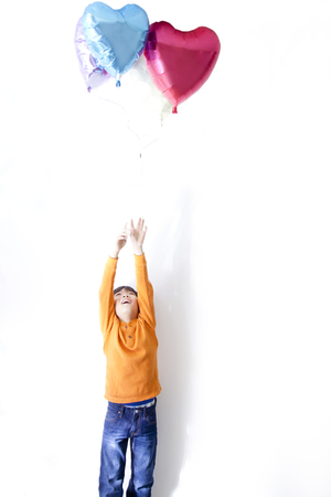 Boy with balloonsの写真素材