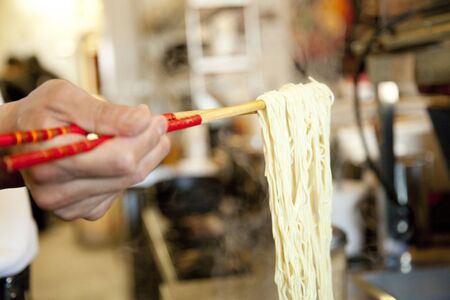 At hand to make ramen noodlesの写真素材