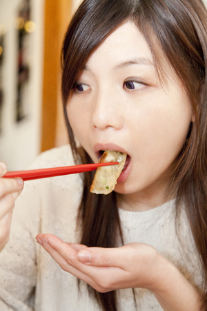 Women who eat dumplingsの写真素材