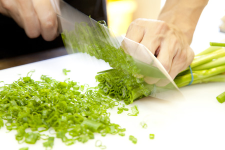 Cut the leeks Cook handの写真素材