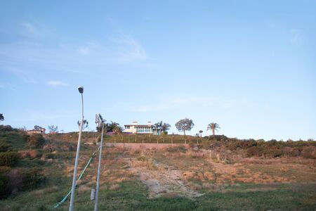 Mansion standing on top of the hillの写真素材