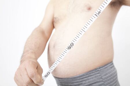 Metabo man to measure the waist circumferenceの写真素材