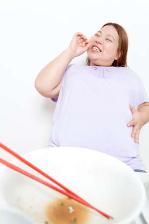 Metabo woman adding toothpickの写真素材