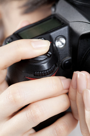 Hand to hold the cameraの写真素材