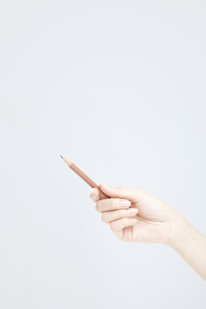 Hand with a pencilの写真素材