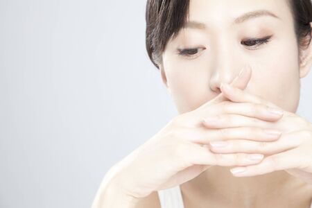 Women Hide mouthの写真素材