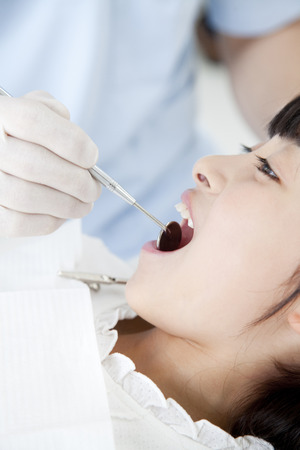 Girls subjected to dental treatmentの写真素材