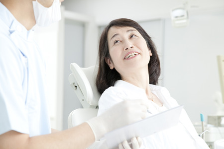 Dentist and the patient to counselingの写真素材
