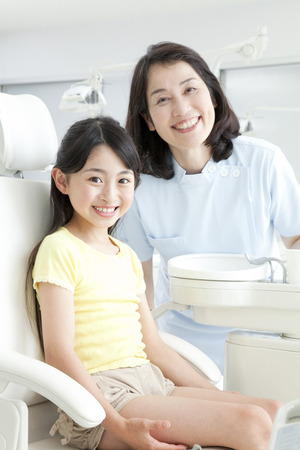 Smile dentist and girlsの写真素材