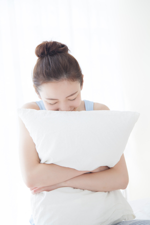 Women Embracing the pillowの写真素材