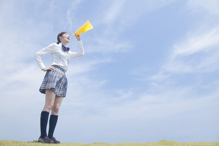 High school girls to cheer with megaphoneの写真素材