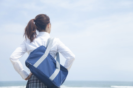 High school girls stare sea
