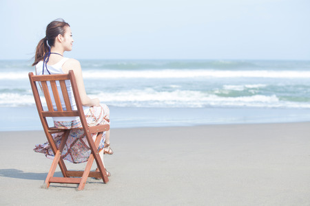 Women who sit on the beachの写真素材