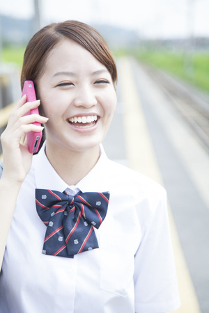 High school girls to call at the station of homeの写真素材