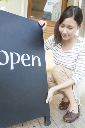 Cafe clerk make a signboardの写真素材