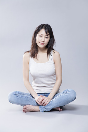 Women sit cross-leggedの写真素材