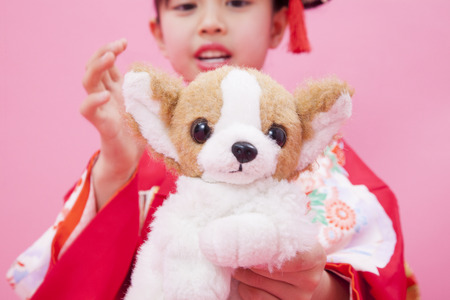 Girl with a dog stuffedの写真素材