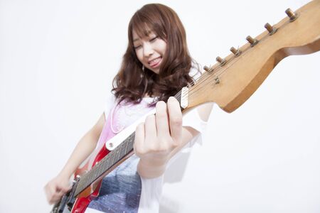 Woman playing the guitarの写真素材
