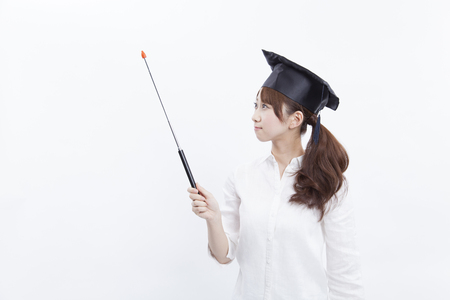College girls to smile with a pointing stickの写真素材
