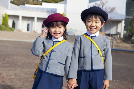 Smile kindergarten children and womenの写真素材