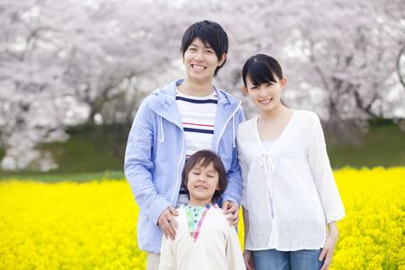 Family to smile at the rape fieldsの写真素材