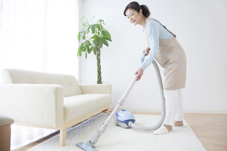Housewives vacuumingの写真素材