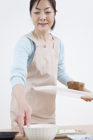 Housewife to put away the dishesの写真素材