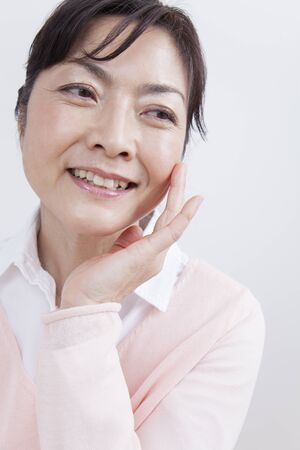 Middle woman smiling faces on handの写真素材