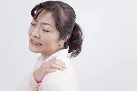 Middle women suffer from stiff neckの写真素材