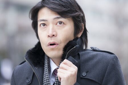 Businessmen make a collar coatの写真素材