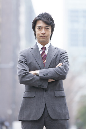 Businessman standing in downtownの写真素材