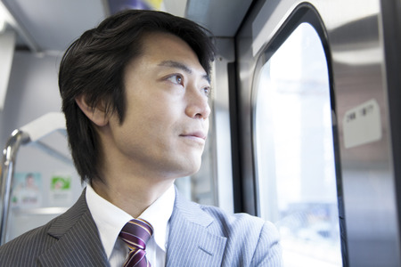 Businessman overlooking the car windowの写真素材