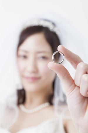 Bride to smile with a wedding ringの写真素材