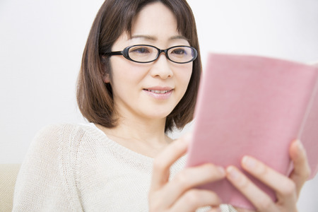 Middle woman readingの写真素材