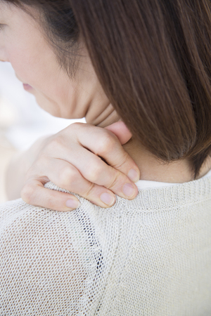 Middle women suffer from stiff neckの写真素材
