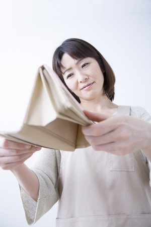 Housewife to turn over the purseの写真素材