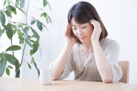 Housewife suffering from headacheの写真素材