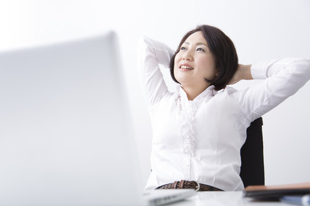 Businesswoman sitting at deskの写真素材