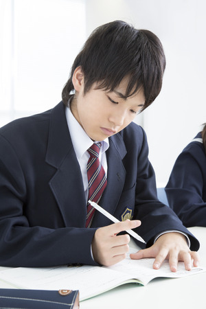 Men's junior high school students to studyの写真素材