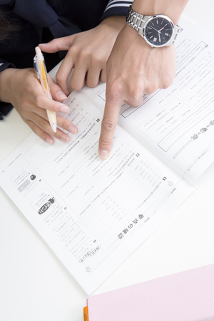 Student and instructor led to study in textの写真素材