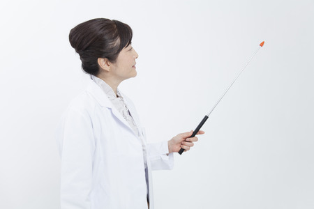 Joy and smile with a pointing stickの写真素材