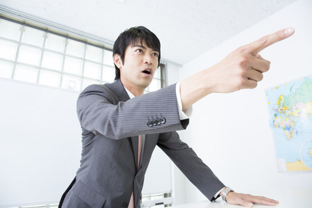 Man pointing a fingerの写真素材