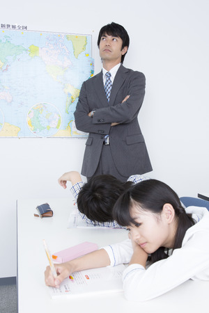 Teachers amazed the elementary school that does not focused in their studyの写真素材