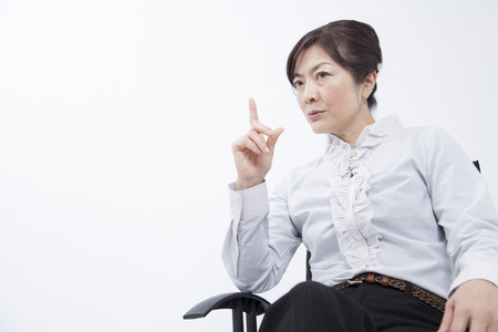 Businesswoman which refers to the fingerの写真素材
