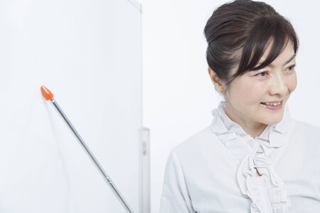 Businesswoman talking points to the Boardの写真素材