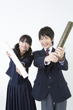 Junior high school students with a diplomaの写真素材