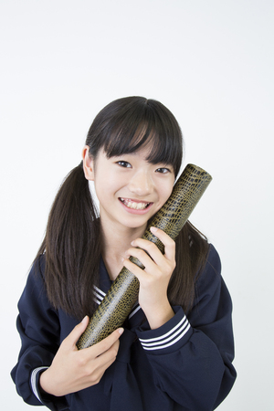 Junior high school girls with a diplomaの写真素材