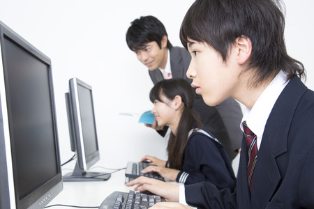 Junior high school students learn computerの写真素材