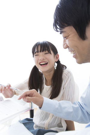 Father teach daughter to study andの写真素材